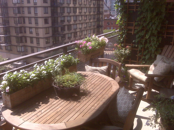Wooden planters on the New York balcony of Devin A. Brown