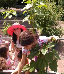 Muscota students help Marissa Ayala tend their garden plots at Swindler Cove.