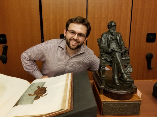 Stephen Fragano with the statue of Darwin the Mertz Library’s Rare Book Room