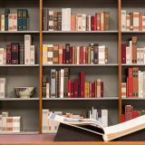 Image of books on a shelf in the Library.