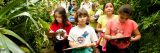 Children taking notes during a tour in the Conservatory.