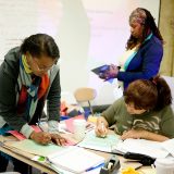 Photo of teachers organizing resources in the GreenSchool