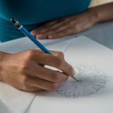 jessica drawing a flower in graphite