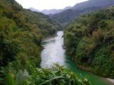 Southeast Asia river in between mountains.