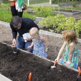 Photo of children participating in Dig Plant Grow activities, ECAG