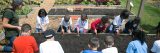 Children digging in soil in the Edible Academy