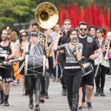 Funkrust, a brass band, marching towards the Visitor Center.