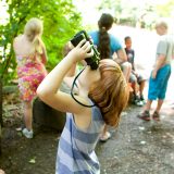 Photo of a student looking through binoculars