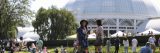 Two visitors enjoy an event outside the Enid A. Haupt Conservatory.