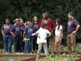 Michelle Obama with a student in the White House vegetable garden