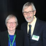 Headshots of Patricia K. Holmgren, Ph.D., and Noel H. Holmgren, Ph.D.