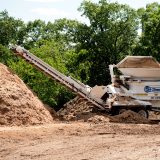 Image of tracker working in the new Green Zone for Recycling.