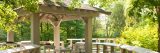 Gazebo in the summer time over the water.