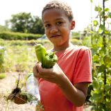 Photo of a student in the Children's Gardening Program, ECAG