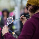 An artist demonstrates glow blowing