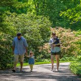 A family walking through the garden on Mother's Day