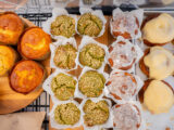 A top-down photo of various baked desserts arranged on a tray
