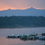 View of the river in Myanmar with boats along the river.