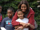 Michelle Obama with a student in the White House vegetable garden