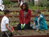Michelle Obama with a student in the White House vegetable garden