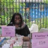 image of volunteer at a community event for a seed swap