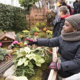 A child pointing to a building at the Holiday Train Show