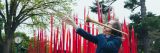 Trumpeter Chris Washburne in front of Dale Chihuly's Red Reeds.