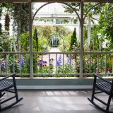 Gazing at the Impressionism display from the porch of a New Englad cottage in the Conservatory.