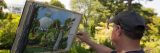 Plein-Air painter, painting the Conservatory.