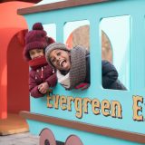 Kids riding the Evergreen Express in the Everett Children's Adventure Garden.