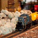 A train chugging along a track at the Holiday Train Show®.
