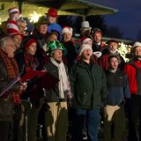 An a cappella group singing during a Bar Car Night.