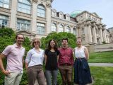 Current Fellows standing in front of a building