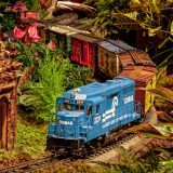 Photo of a model train traveling through the Holiday Train Show