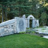 Photo of a henge with a forest in the background