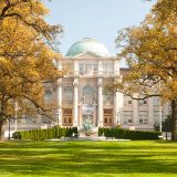 The front of the Mertz Library Building in fall.