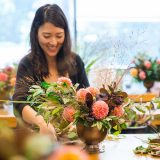 A woman doing an activity in floral design