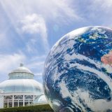 Photo of a giant inflatable globe in front of the Conservatory