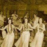 An antique picture of hula performers dancing