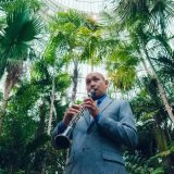 A musician playing the clarinet in the Conservatory