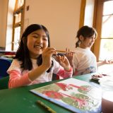 Photo of students taking part in Discovery Center activities