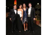 A photo of four guests at the Conservatory Ball