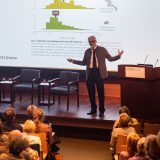 Photo of a man giving a Lecture
