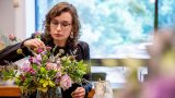 Adult Education student making a floral arrangement.