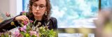 Adult Education student making a floral arrangement.