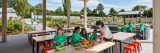 An instructor teaching children at the Edible Academy.