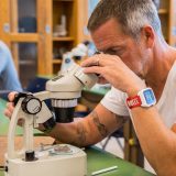 Student using a microscope