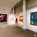 A visitor viewing Burle Marx's paintings in the Library Art Gallery.