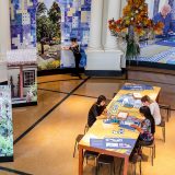 An indoor installation inspired by Sitío Roberto Burle Marx, with blue and white illustrated tiles on the walls.