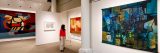 A visitor viewing Burle Marx's paintings in the Library Art Gallery.